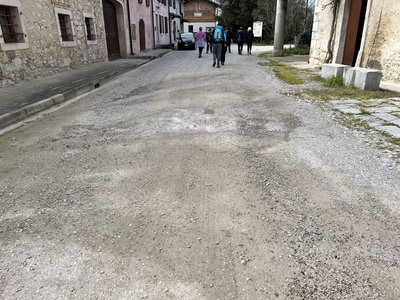 Photo 30 - Stretch of dirt road with sparse gravel and puddles