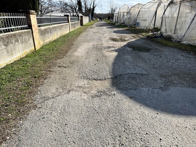 Photo 38 - Path on bumpy asphalt road