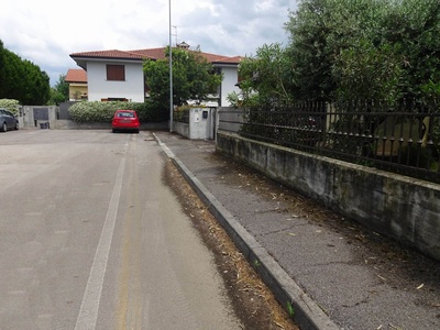 Photo 21 - Path on the sidewalk ends in the residential parking