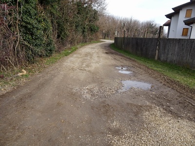 Photo 23 - Path on dirt road next to a house